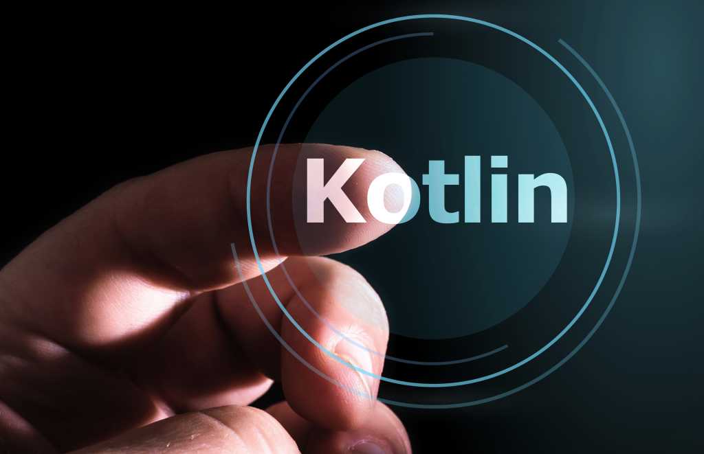 Finger selecting the word "Kotlin" on a virtual screen.