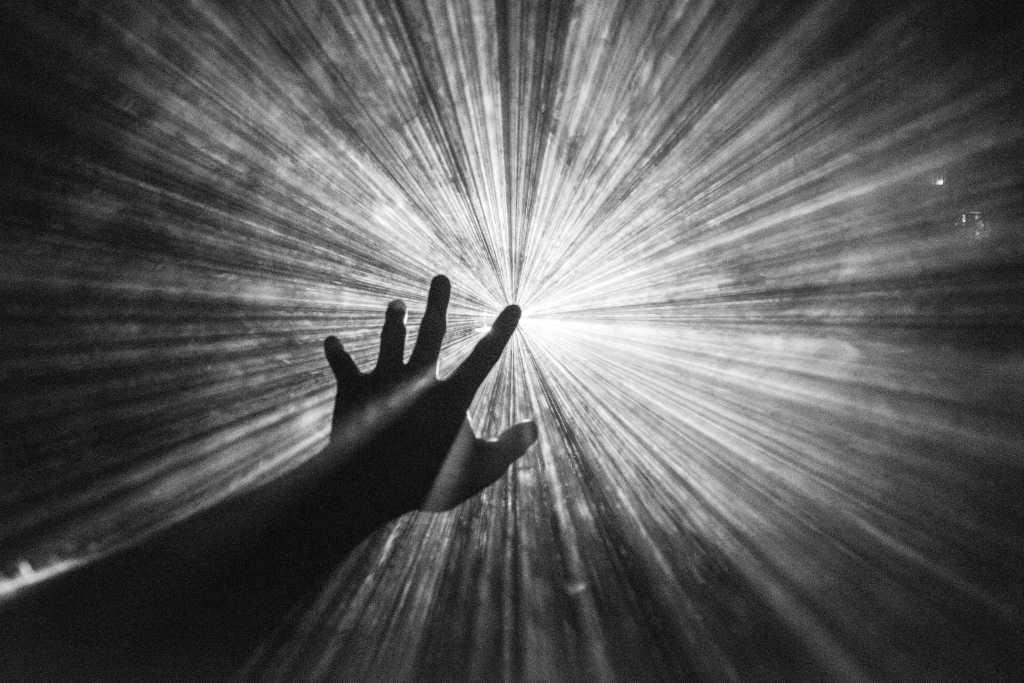 aspiration; vision; hand reaching for the light