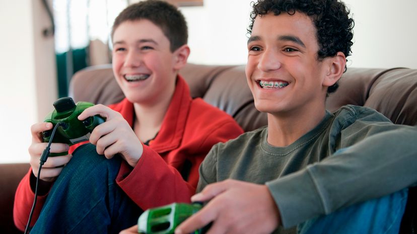 Two boys playing video games. 