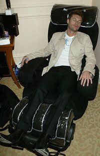 Television host Ryan Seacrest catches a quick nap in an iJoy massage chair. Seacrest out!