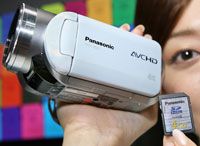 This high-definition digital video camera captures images onto a memory card.